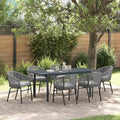 Conjunto de comedor exterior de ratán gris con mesa extensible y seis sillas resistentes al clima