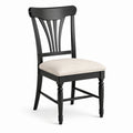 Silla de madera negra con asiento de tela beige